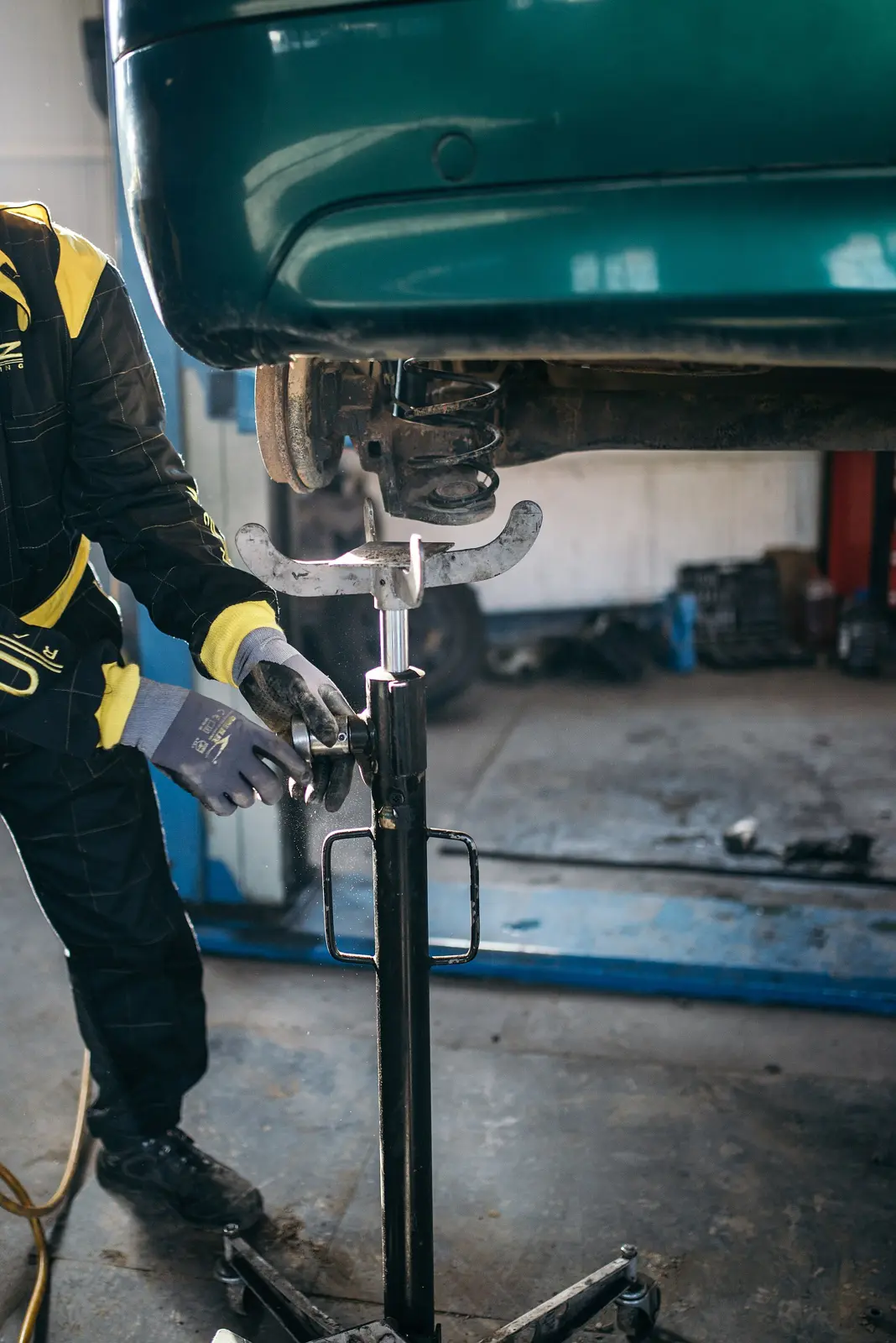 Mechanic working on a car's suspension